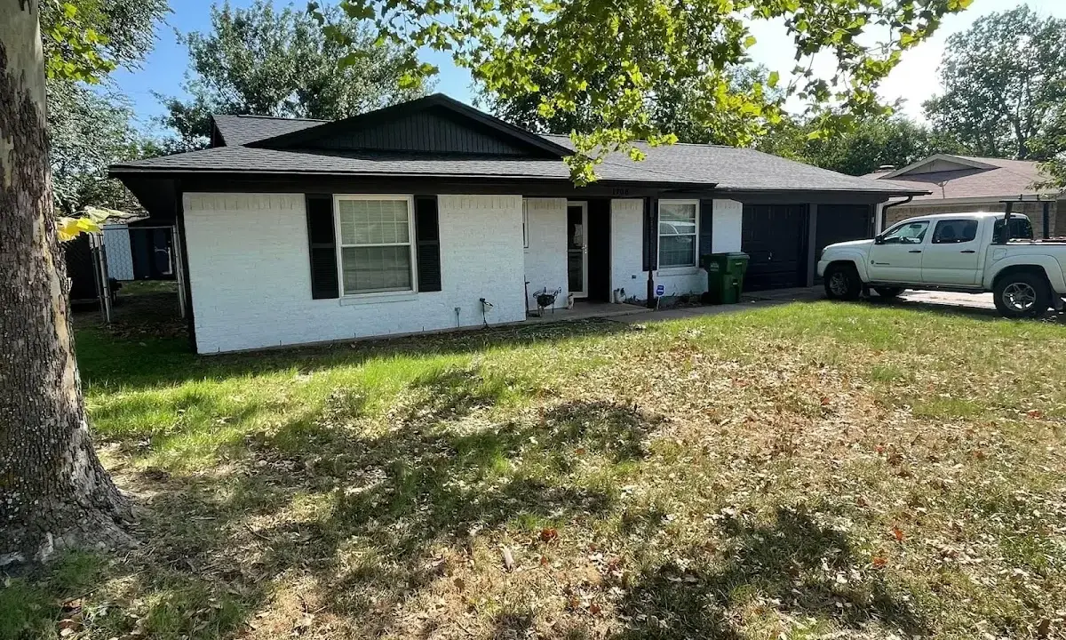 Professional roofing crew working on a residential roof in Skidaway Island